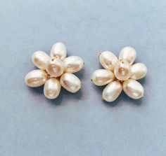 Pearl Flower Stud Earrings, Bridesmaids Small Flower Stud, Pearl Flower Bridesmaids Earrings, Delicate Pearl Studs Pearl small white flower studs are embellished with tiny freshwater pearls.  These would make a perfect Bridesmaids gift! These sizes are great for your special day or everyday earrings. The earrings measures approximately 3/4 of an inch. The posts are Gold plated. Please sample order one pair before making your bridesmaids purchase if you are unsure on style, length, color or finis White Flower Shape Cluster Earrings For Formal Occasions, White Flower Cluster Earrings For Formal Events, Formal Pearl White Flower Bridal Earrings, Bridesmaids Earrings, Small White Flowers, Flower Stud Earrings, Flower Stud, Bridesmaid Flowers, Pearl Flower