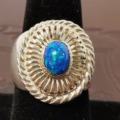 Beautific fire opal and sterling silver ring..this lovely ring has a substantial amount of silver to it with  a minimal design that accentuates the gorgeous fire opal cabochon in the center..the band is solid and wide on the sides..measures us size 8 3/4..in like new condition and ready to be gifted..will ship insured us mail and etsy will send shipping / tracking info when shipped. www.etsy.com/shop/vintagesouthwest for our complete shop arizona residents will pay current tax rates as will residents in states that collect tax st1 Southwestern Sterling Silver Opal Ring, Handmade Silver Opal Ring In Southwestern Style, Handmade Southwestern Silver Opal Ring, Southwestern Silver Opal Ring In Sterling Silver, Silver Bear, Gifts Vintage, Southwest Jewelry, Handcrafted Rings, Lovely Ring