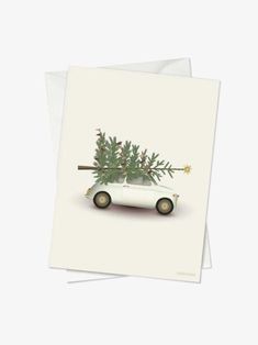 a white car with a christmas tree on top