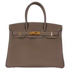 100% authentic Hermès Birkin 30 bag in Etoupe (taupe) Veau Togo leather with gold-plated hardware and contrasting white stitching. Lined in Chèvre (goat skin) with an open pocket against the front and a zipper pocket against the back. Has been carried and is in virtually new condition. Comes with Full Set. Measurements Model H027633CC 18 Height 22cm (8.6in) Width 30cm (11.7in) Depth 15cm (5.9in) Drop of the Handle 10.5cm (4.1in) Hardware Gold-Plated Blindstamp Z (2021) All our listings include o Everyday Togo Leather Bag With Leather Lining, Designer Togo Leather Bag For Everyday Use, Designer Togo Leather Bag, Business Bags In Taupe With Palladium Hardware, Taupe Business Bags With Palladium Hardware, Taupe Travel Bag With Palladium Hardware, Luxury Togo Leather Office Bag, Classic Taupe Bags With Gold-tone Hardware, Brown Togo Leather Travel Bag