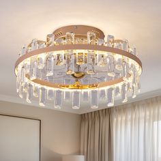 a chandelier hanging from the ceiling in a bedroom