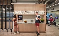 a man and woman standing in front of a counter