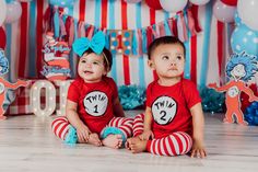 two children sitting on the floor with dr seuss and cat in the hat shirts