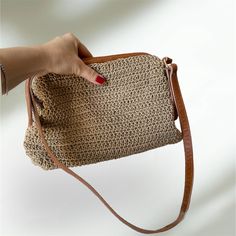 Stylish Handmade Crochet Bag for fashionable woman.  High quality metarials. Beige color cotton yarn  enriched with tan genuine leather. Can be used as a clutch or shoulder bag with adjustable handle. Perfect from day to night. Size : 27x18x10 cm Bag Mouth Size : 24 cm Adjustable handle :70cm-80cm Also perfect gift for your loved ones on special days, Mother's Day, Birthday, Valentine's Day, anniversary and graduations. Thank you for visiting our store! Knitted Clutch, Handmade Crochet Bags, Luxury Bag, Bag Handmade, Designer Bag, Pouch Bag, Beige Color, Handmade Crochet, Crochet Bag