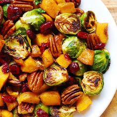 brussel sprouts, brussels sprouts, and pecans in a white bowl