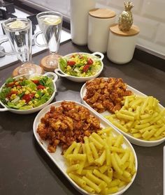 several plates of food on a counter top