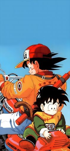 two young boys riding on the back of an orange motorbike in front of a blue sky