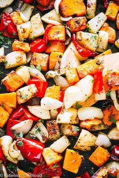 roasted vegetables with herbs and seasoning in a pan