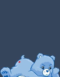 a blue teddy bear laying on its back with hearts in it's paws and eyes