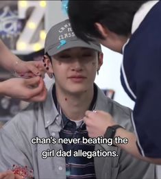 a young man is getting his hair done by two other men and the caption reads, chan's never beating the girl dad alligators