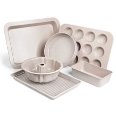 an assortment of white dishes and pans