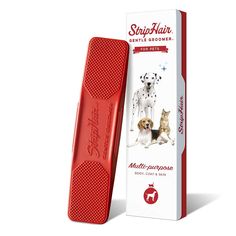 a red brush with a dog and cat on it next to a box of toothpaste