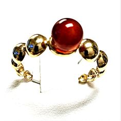 This Beautiful Ring Is Perfect For Those Who Love To Make A Statement With Their Jewelry. Crafted From 18k Yellow Gold, This Bubble Ring Features A Stunning Red Agate Stone As Its Main Attraction. The Ring Is Designed To Fit A Size 5.5 Finger And Is Branded As Saudi Gold, Known For Their High-Quality Jewelry Pieces. In Addition To The Red Agate Stone, The Bubble Ring Also Boasts A Unique Bubble-Like Design That Will Surely Catch The Eye Of Any Onlooker. It Is Perfect For Any Occasion, Whether It Modern Red Cabochon Jewelry, Elegant Red Polished Gemstones, Elegant Red Cabochon Gemstones, Modern Carnelian Gemstone Jewelry, Formal Carnelian Oval Cabochon Jewelry, Luxury Red Cabochon Ruby Ring, Formal Oval Cabochon Carnelian Jewelry, Formal Red Carnelian Jewelry, Modern Red Carnelian Jewelry