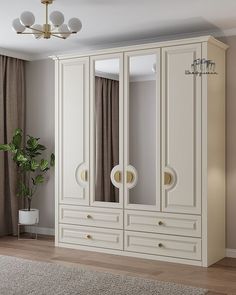 a large white armoire sitting in a living room next to a potted plant