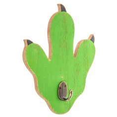 a green cactus shaped magnet with a hook on it