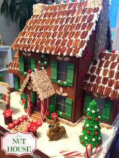 a gingerbread house decorated with candy canes and icing