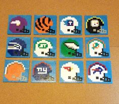 nine pixellated images of different sports teams are arranged in squares on a brown table