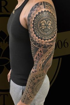 a man with a tattoo on his arm