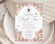 an elegant floral tea party with pink roses on the front and white paper in the back