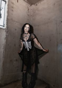 will rattle their bones. This corset crop top has a sleeveless tube design, a zip up back, and skeleton ribcage graphic on the front. Skeleton Corset, Tube Design, Costume Store, Corset Crop Top, Rib Cage, Corset Top, Dolls Kill, The Dead, Exclusive Collection