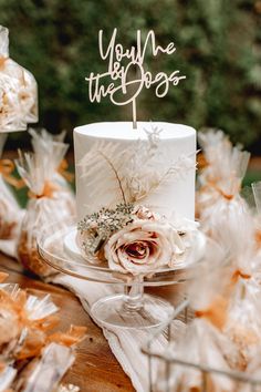 a white cake sitting on top of a wooden table