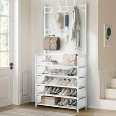 a white shoe rack filled with shoes and purses