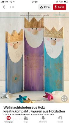 an image of three paper dolls with crowns on them, one is blue and the other is pink