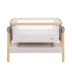 the baby crib is made with wood and fabric