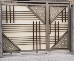 an iron gate with geometric designs on it