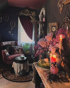 a living room filled with lots of furniture and flowers on top of a table next to a window