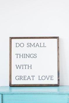 a blue dresser with a sign that says do small things with great love on it