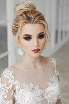 a woman with blonde hair wearing a wedding dress