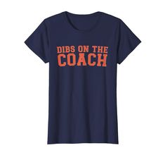 a women's navy t - shirt that says dibs on the coach in orange