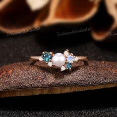 Akoya Pearl Engagement Ring Blue Green Sapphire Ring Moonstone Diamond Moissanite Cluster Wedding Rings for Women Anniversary Gift for Her  Alexandrite & Moonstone Cluster Ring: https://www.etsy.com/listing/1702728648/akoya-pearl-engagement-ring-alexandrite Pink Sapphire Cluster Ring: https://www.etsy.com/listing/1714772356/akoya-pearl-engagement-ring-pink Natural Opal Cluster Ring: https://www.etsy.com/listing/1714198832/akoya-pearl-engagement-ring-opal-ring RING DESCRIPTION ✦Engagement Ring ✴C Blue Pearl Engagement Ring, Luxury Cluster Pearl Engagement Ring, Luxury Pearl Engagement Ring With Gemstone, Multi-stone Diamond Pearl Ring For Wedding, White Sapphire Round Ring For Wedding, Blue Multi-stone Opal Ring For Wedding, Anniversary Pearl Ring With Moonstone, White Sapphire Wedding Ring, Round Shape, Anniversary Moonstone Pearl Ring