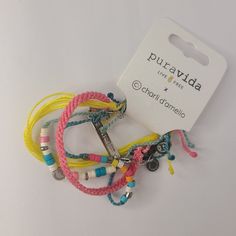 Nwt Pura Vida Charli D'amelio Bracelet Style Holiday Pack - Adjustable Bands, Assorted Designs - Set Of 4 Founded In Costa Rica - Thoughtfully Designed, Each Pura Vida Accessory Is Crafted By Expert Artisans In Costa Rica, El Salvador, India, And More. Our Goal Is To Provide Sustainable Jobs To Artisans Worldwide And Give Back To Causes You Care About. 4 Bright Bracelets To Brighten Your Mood - Update Your Everyday Look By Wearing This Bracelet Stack That Exudes Fun And Playful Vibes! It Include Bohemian Yellow Bracelets For Everyday Wear, Yellow Braided Bracelets For Beach, Handmade Trendy Yellow Friendship Bracelets, Yellow Bohemian Friendship Bracelets For Everyday, Yellow Bohemian Friendship Bracelets, Bohemian Yellow Friendship Bracelets, Trendy Yellow Bracelets For Summer, Casual Adjustable Yellow Bracelets, Casual Yellow Adjustable Bracelets