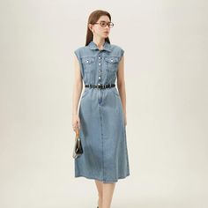 Discover Your New Summer Favorite Step into summer with elegance and comfort in our Summer Chic Sleeveless Denim Dress. Designed for the sophisticated woman who loves to blend casual comfort with a touch of retro flair, this dress is a must-have for your warm-weather wardrobe. Its sleek, straight silhouette and knee-length cut make it versatile for both office and leisure, ensuring you look polished wherever you go. Product Features Fabric: Crafted from 100% high-quality cotton, offering breatha Casual Blue Sleeveless Dress With Pockets, Blue Sleeveless Dress With Pockets For Spring, Casual Sleeveless Fitted Dress With Pockets, Summer Blue Denim Vest For Workwear, Blue Denim Vest For Workwear In Summer, Short Sleeve Denim Vest For Spring, Short Sleeve Denim Blue Vest For Spring, Light Blue Sleeveless Knee-length Dress For Spring, Chic Denim Blue Vest For Spring