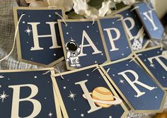 the happy birthday signs have space themed designs on them