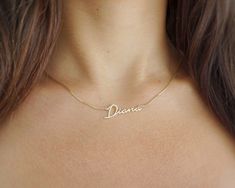 When it comes to name jewelry, this classic has it all. This stunning name necklace features a sleek box chain and is hand-crafted from premium 14k or 10k gold. Adorned with a sparkling diamond set into the nameplate, it adds a touch of elegance to any look. Perfect for personalizing your style or as a meaningful gift! Rendered in a stunning script, it is perfect for showcasing your name, the name of a loved one, your handwriting, your signature, or even a favorite word to inspire or motivate when needed.  100% Handmade in Boca Raton, FL - Each necklace is made to order.  Chain Style: Box Chain. Around 0.8mm Diamond: Natural Diamond Available in 14K, 10K - White Gold, Yellow Gold, and Rose Gold.  Perfect gift for any occasion and any age - Religious holidays, Confirmation, baptism, Christm Classic White Gold Necklaces With Custom Name, Classic White Gold Name Necklace, Classic White Gold Name Necklace As Personalized Gift, Classic White Gold Name Necklace For Personalized Gift, Classic White Gold Nameplate Necklace, Classic Nameplate Necklace, Classic White Gold Custom Name Necklace, Classic White Gold Name Necklace As Gift, Classic Nameplate Necklaces