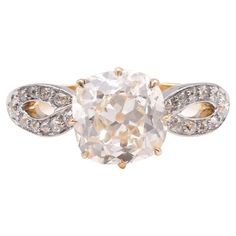 an antique diamond ring with two tone gold and white diamonds