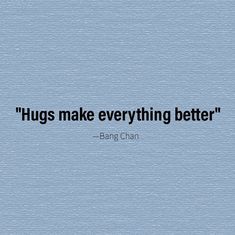 a blue wall with a quote on it that says, hugs make everything better bang chan