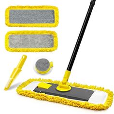 a yellow mop and two cleaning sponges on a white background