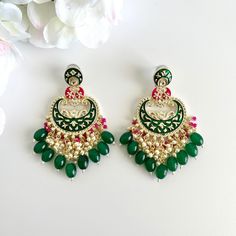 Add some color to your outfit with these traditional embellished earrings! These gorgeous kundan meenakari earrings have beaded detailing and hanging cluster pearls. Length 3.5" | Width 1.5" Items are carefully packed and ready for gifting. All pictures are taken in natural light please allow for slight variations in color due to camera settings. Jewelry Care ✨Protect your jewelry in a closed box or pouch   ✨Wear jewelry after you have applied lotion or perfume ✨Gently buff with a soft cotton cl Temple Jewelry Kundan Danglers With Zari Work, Kundan Danglers With Zari Work In Temple Jewelry Style, Kundan Temple Jewelry Earrings For Festivals, Kundan Meenakari Earrings In Temple Jewelry Style, Temple Jewelry Kundan Earrings For Festivals, Festival Kundan Temple Jewelry Earrings, Diwali Temple Jewelry Earrings With Zari Work, Traditional Chandbali Earrings With Zari Work, Diwali Temple Jewelry Kundan Earrings