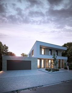 a modern house with two garages on the street