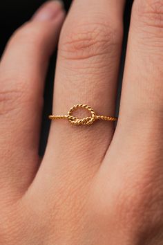 This ring is really cute and easy to wear! The twisted open knot adds a bit of extra detail to any stack. This is one single length of metal that I've knotted into a pretzel-like knot and soldered around the back. This listing is for ONE SINGLE RING. Each ring is made from 14K GOLD FILL. Shown stacked with our other minimalist knot rings and extra thick ring! Every piece is organic and unique — no two Hannah Naomi pieces are exactly alike.Hand-crafted to order in our Portland, OR studio. Knot Rings, Thick Ring, Single Ring, Knot Ring, Huggie Hoop Earrings, Gold Texture, Stacking Ring, Stackable Rings, Promise Ring