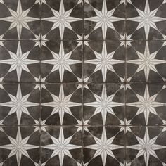 a black and white tiled floor with stars on it