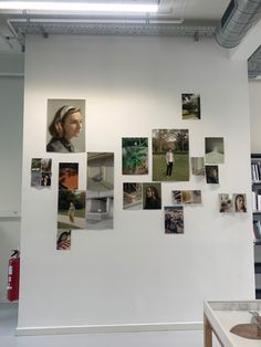 a white wall with many pictures on it