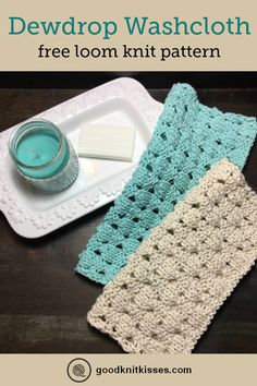 two crocheted dishcloths sitting on top of a white plate next to a candle