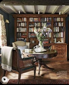 a living room filled with furniture and bookshelves