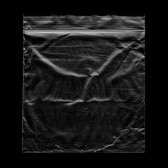 a black and white photo of a piece of plastic