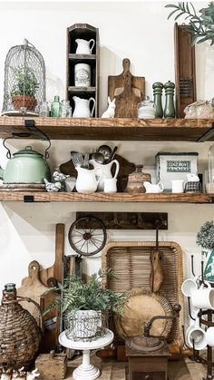 the shelves are filled with pots, baskets and other items on display in this room